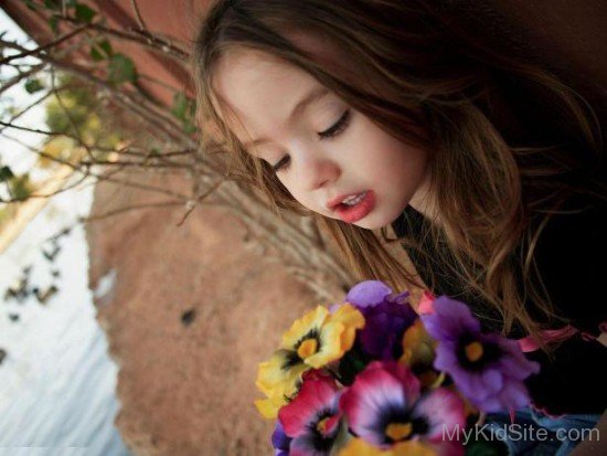 Cute Girl With Bunch Of Flowers