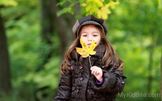 Cute Girl With Fall Leaf