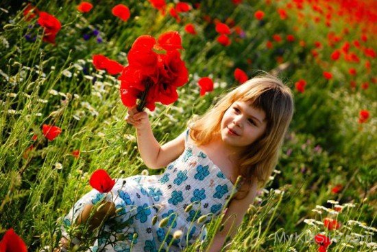 Girl Playing With Flowers
