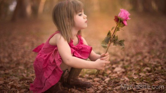 Cute Kid Holding Rose