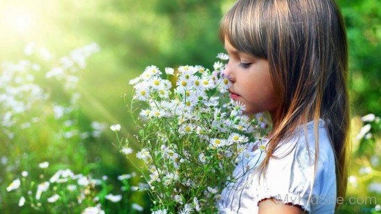 Cute Kid Holding White Flowers