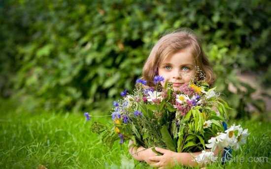 Cute Kid With Bunch Of Flowers