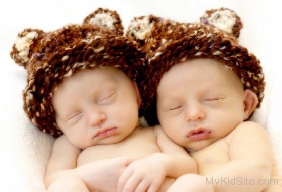 Cute Twins Baby Wearing Brown Hat