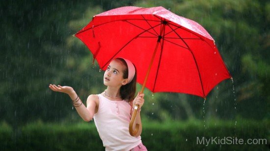 Girl Playing In Rain