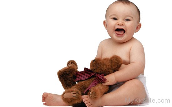 Baby Boy Holding Teddy Bear