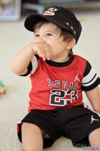 Baby Boy In Black Cap