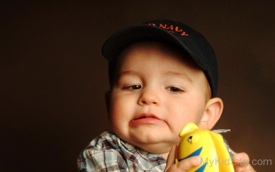 Baby Boy Wearing Black Cap