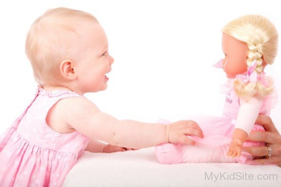 Baby Girl Playing With Doll