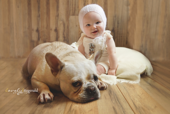 Baby Girl Sitting With Dog