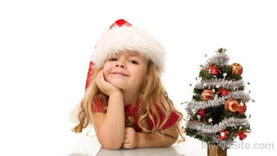 Baby Girl wearing Santa Cap