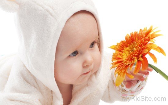Baby Holding Flower 