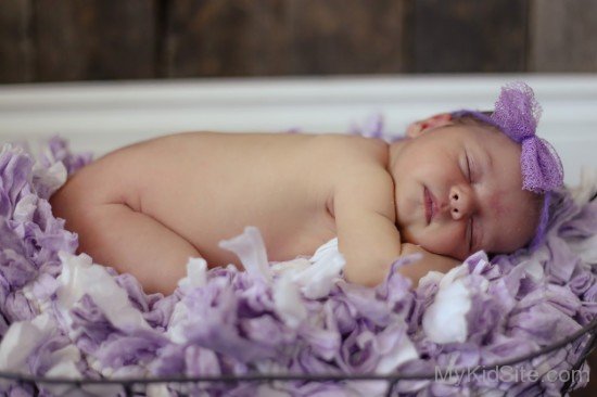 Baby Sleeping On Flowers