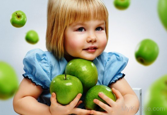 Cute Baby Girl With Apples