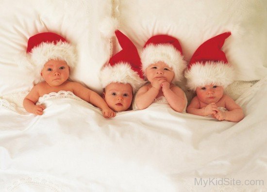 Little Babies Wearing Santa Caps