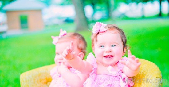 Pretty Twins Girl Playing