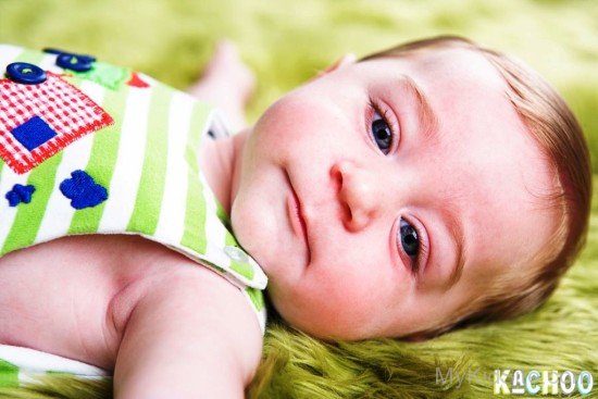 Sweet Baby Boy Watching In Green Dress