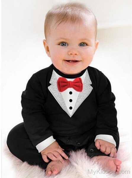 Sweet Boy In Black Dress With Red Bow
