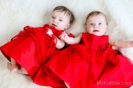 Twins Baby Girls In Red Dress