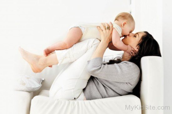 Baby Boy Playing With Mom