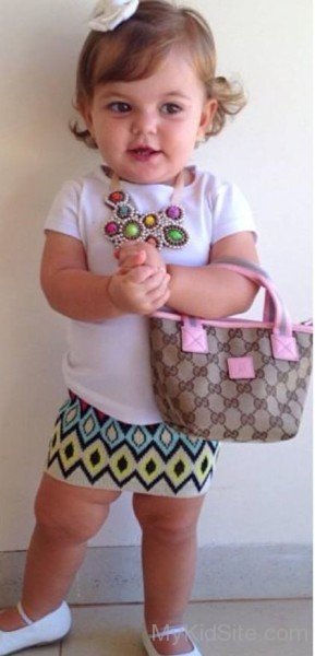 Baby Girl Holding Purse