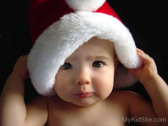 Charming Baby Wearing Santa Cap