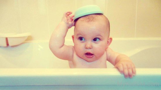 Cute Baby Boy Sitting In Tub