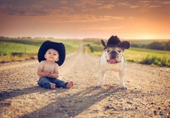 Cute Baby Boy Sitting With Dog