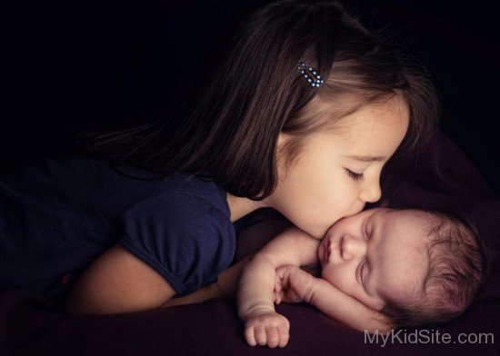 Cute Baby Girl Kissing Baby Boy