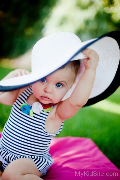 Cute Baby Girl Wearing White Hat