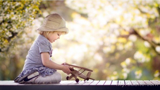 Girl Playing Aircraft Toy