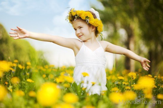 Girl With Flower In Field