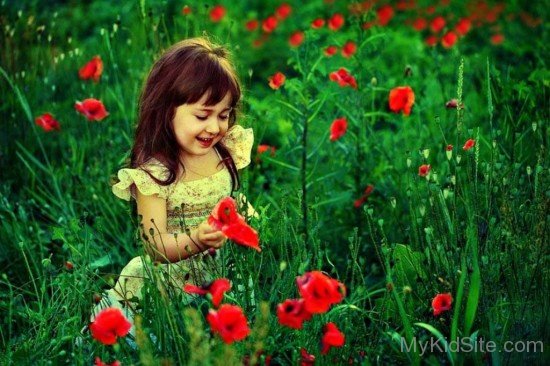 Sweet Little Girl In Garden